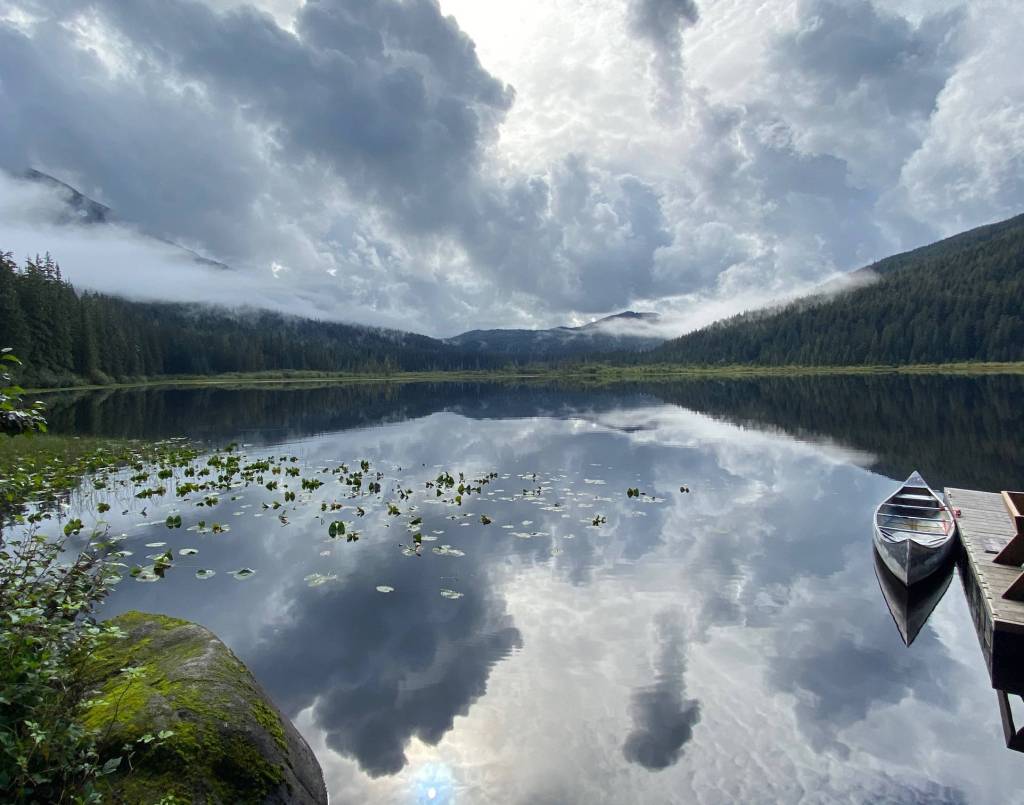 Reflections in Windfall Lake of a brightening sky on Sept. 4, 2020. (Courtesy Photo / Denise Carroll)