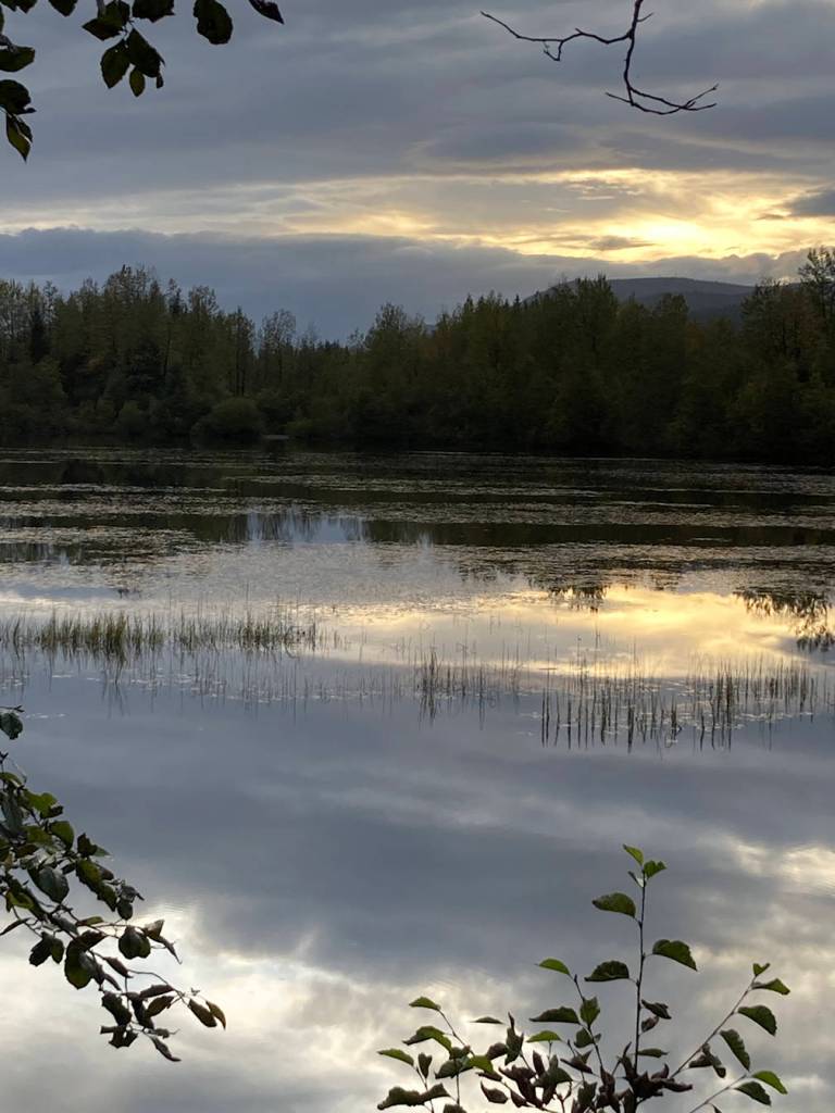 The sun peeks through the clouds over Dredge Lakes. (Courtesy Photo / Deborah Rudis)