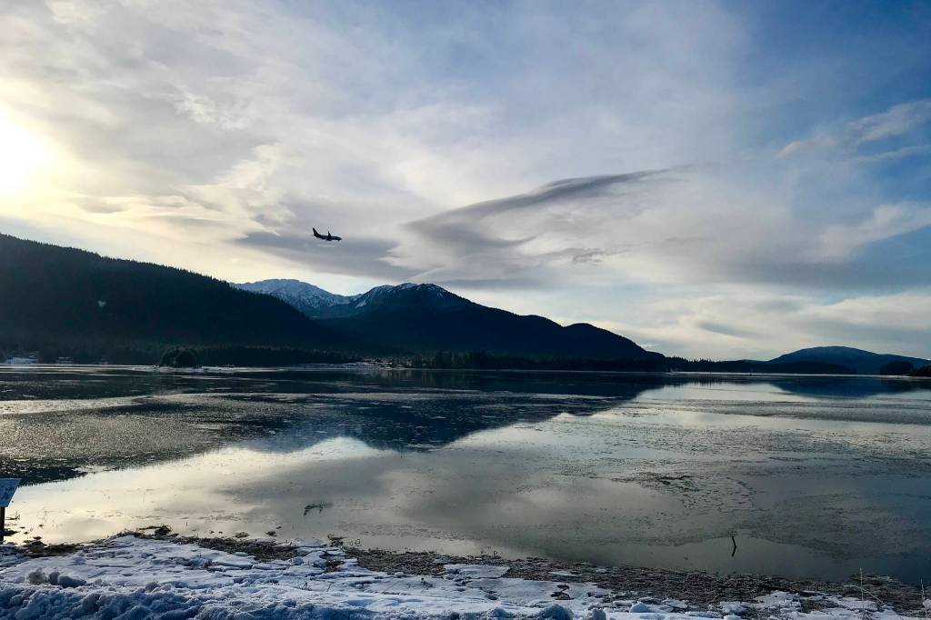 A plane flies over the Mendenhall Wetlands as seen from the Egan Drive pull off on Nov.16. (Courtesy Photo / Asia Ver)