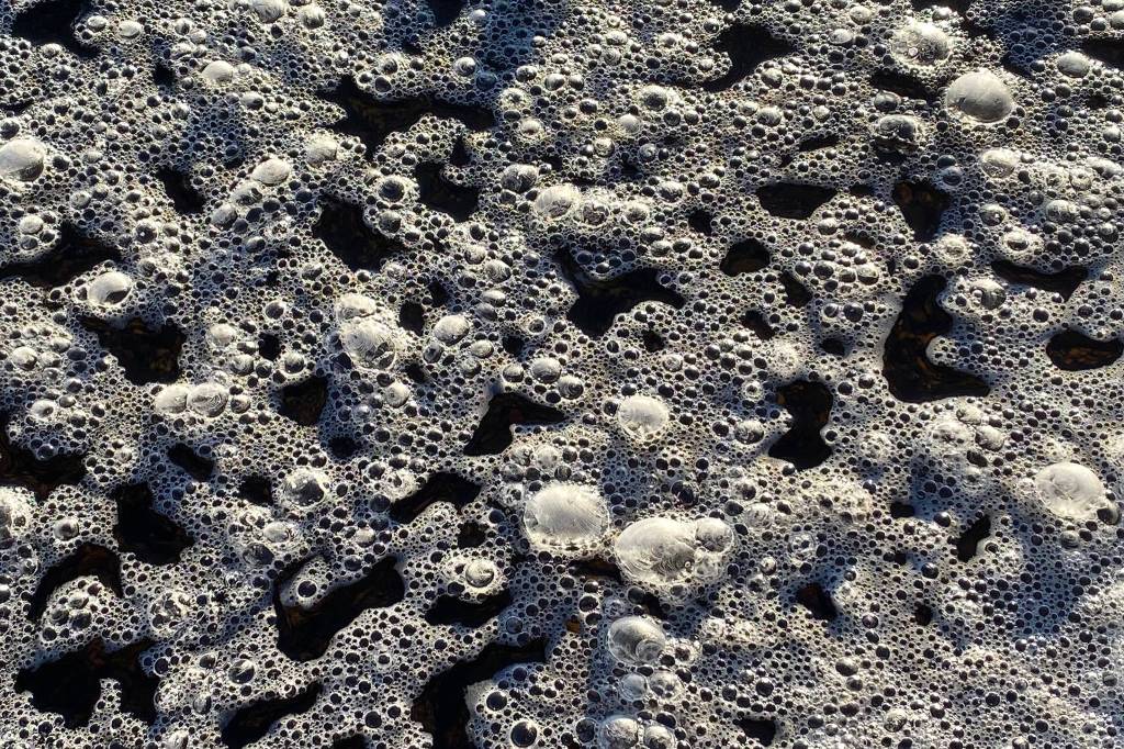 Bubbly frozen foam on Cowee Creek as seen pn Jan. 21. (Courtesy Photo / Denise Carroll)