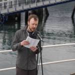 Carl Brodersen reads the names of those who died at sea during the 31st annual Blessing of the Fleet and Reading of Names at the Alaska Commercial Fishermens Memorial in Juneau on May 1, 2021. (Michael S. Lockett / Juneau Empire)