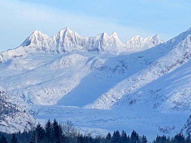 Snow-covered Mendenhall glacier and towers glisten in the morning sun’s rays on Dec. 11. (Courtesy Photo / Denise Carroll)