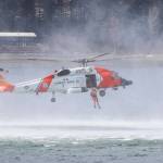 A rescue swimmer drops out of a Coast Guard Air Station Sitka MH-60 Jayhawk during a demonstration at the 12th Annual Maritime Festival on May 7, 2022. (Michael S. Lockett / Juneau Empire)