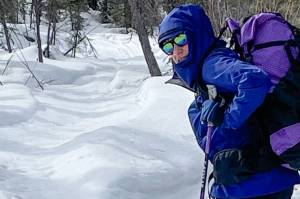 Kristen Rozell skis past grizzly bear tracks pressed into a snowmachine trail near Fairbanks on April 23, 2023. (Courtesy Photo / Ned Rozell)