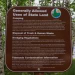 A generally allowed uses of state land sign is posted near the Sheep Creek delta. (Jasz Garrett / Juneau Empire)