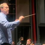 Dwayne Corbin conducts the Juneau Symphony during a rehearsal Tuesday for this weekends concerts at Juneau-Douglas High School: Yadaa.at Kalé. (Mark Sabbatini / Juneau Empire)