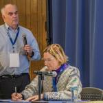 Mark Myers, head of the U.S. Arctic Research Commission, leads a discussion on the potential of geologic hydrogen at a conference in Fairbanks recently. Alaska State Senator Cathy Giessel takes notes. (Photo by Eric Marshall)
