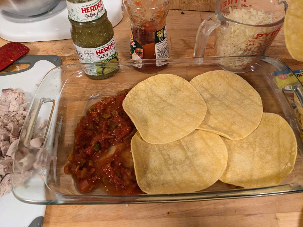 Layering tortillas and other ingredients for a casserole. (Photo by Patty Schied)