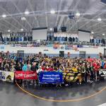 The Juneau Youth Wrestling Club pose with other clubs at the Alaska USA Wrestling 2025 Folkstyle, Greco-Roman & Freestyle State Championships on May 1-3 at the Curtis D. Menard Memorial Sports Center in Wasilla. (Photo courtesy JYWC)