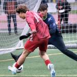 Juneau-Douglas High School: Yadaa.at Kalé senior Kai Ciambor (14) has his shot blocked by Soldotna junior keeper Luke Hillyer during the Crimson Bears 3-0 win over the Stars on Thursday at Adair Kennedy Memorial Park. (Klas Stolpe / Juneau Empire)