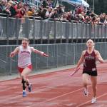 In this file photo Juneau-Douglas High School: Yadaa.at Kalé freshman Bella Connally, Ketchikan senior Clara Odden and Sitka junior Adalyna Moore race to the finish of the 4x100 relay during the Capital City Invitational Track & Field Meet in Juneau on April 26. (Klas Stolpe / Juneau Empire file photo)