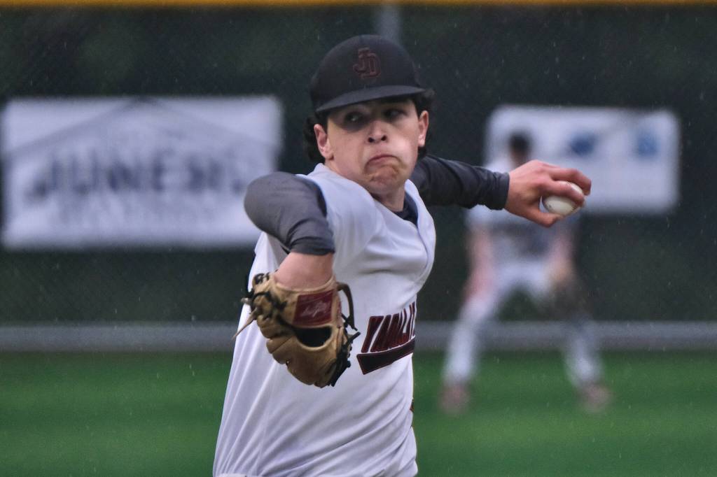 Juneau-Douglas High School: Yadaa.at Kalé junior Riley Fick delivers a pitch against Ketchikan during the Crimson Bears 17-7 win over the Kings Friday at Adair-Kennedy Memorial Park. (Klas Stolpe / Juneau Empire)