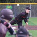Juneau-Douglas High School: Yadaa.at Kalé senior Christian Nelson delivers a pitch during the Crimson Bears baseball senior night against Ketchikan Saturday at Adair-Kennedy Memorial Park. (Klas Stolpe / Juneau Empire)
