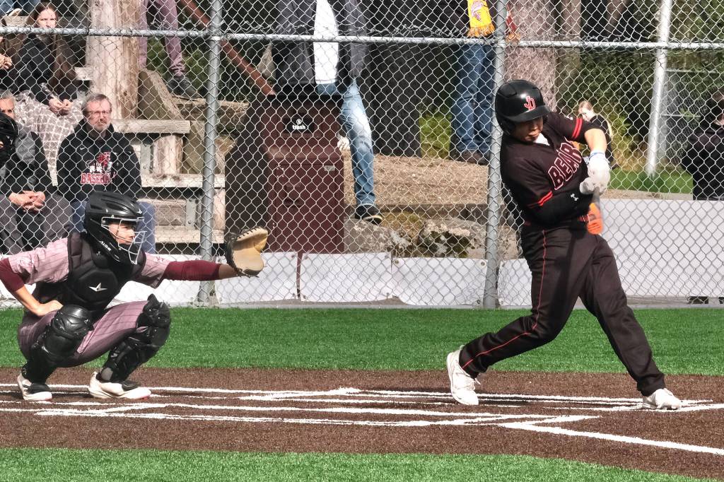 Juneau-Douglas High School: Yadaa.at Kalé senior JJ McCormick connects on a pitch during the Crimson Bears baseball senior night against Ketchikan Saturday at Adair-Kennedy Memorial Park. (Klas Stolpe / Juneau Empire)