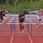 Ketchikan freshman Claire Ruaro (5) and JDHS freshman Addie Hartman (3) take the final jump in the girls 100 hurdles ahead ofJuneau-Douglas High School: Yadaa.at Kalé senior Laina Mesdag (7), JD junior Isabella Reyes-Boyer (6), KTN sophomore Mariah Colbert (4), JD junior Kira Tupou and KTN sophomore Kiera Arnold during the Region V Track & Field Championships at Juneaus Thunder Mountain Middle School on Friday. (Klas Stolpe / Juneau Empire)
