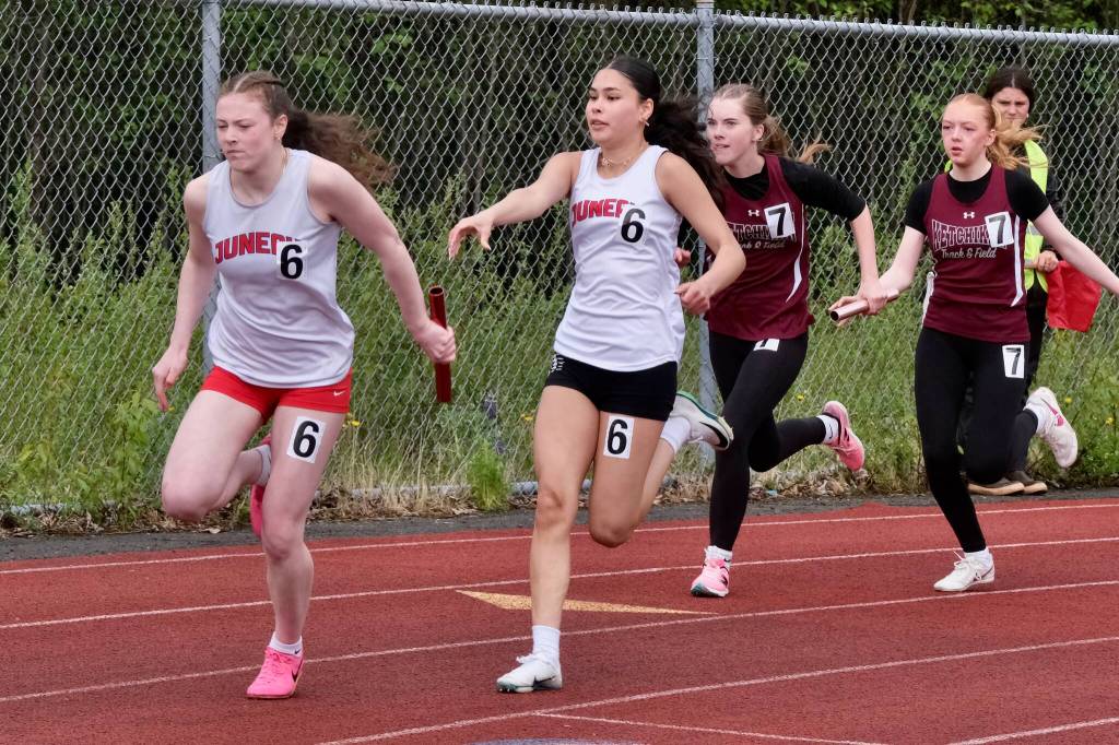 Juneau-Douglas High School: Yadaa.at Kalé freshman Addie Hartman takes the baton from classmate Shandiin Frommherz in the girls 4x100 relay during the Region V Track & Field Championships at Juneaus Thunder Mountain Middle School on Friday. (Klas Stolpe / Juneau Empire)