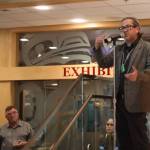 Joe Nelson, interim president of Southeast Alaska regional Native corporation Sealaska, spoke at a reception for state lawmakers and their aides in April. His green commercial fishing permit cards hung from his neck. (Nathaniel Herz/Northern Journal)