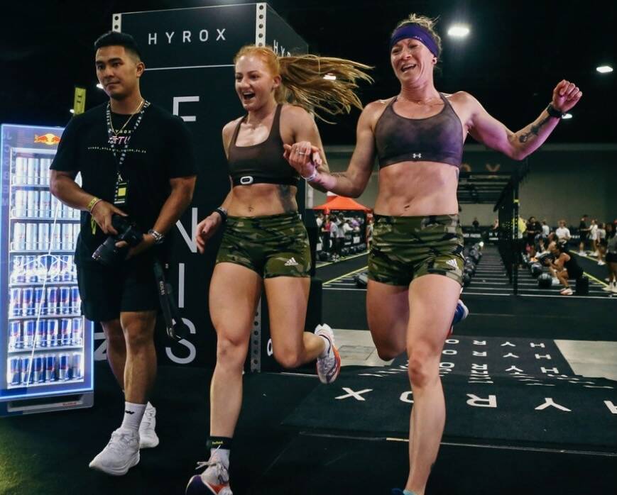 Chrish Newell and partner Jess Contreras, cross the finish line at the HYROX 2025 Atlanta Doubles in late April. They qualified for the World Championships scheduled Sunday, June 15, 2025, in Chicago. (Photo courtesy Chrish Newell)