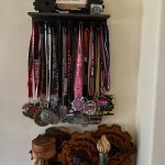 Chrish Newells multitude of awards for her strength endurance obstacle races. (Photo courtesy Chrish Newell)