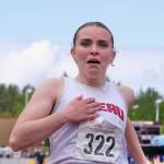 Juneau-Douglas High School: Yadaa.at Kalé freshman Bella Connally crosses the finish line in emotional disbelief as she wins the Division I 100-meter dash during the 2025 ASAA/First Bank Alaska State Track & Field Championships on Saturday at Anchorages Dimond High School. (Klas Stolpe / Juneau Empire)