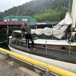 Blake Byers explains what items are missing from his boat, after it was ransacked sometime in recent months, at a downtown Juneau dock on Tuesday, June 3, 2025. (Mark Sabbatini / Juneau Empire)