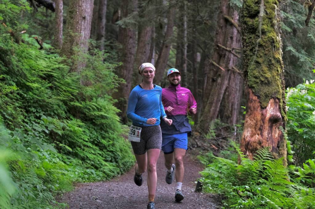Snow Doubts Lauren Tanel and Dimond Dogs David Fure run the Auke Lake Trail in the first leg of the Seacoast Relay on Sunday, June 8, 2025. (Klas Stolpe / Juneau Empire)
