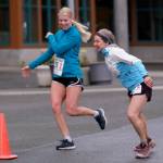 Magy Elliott of team Four Moms, One Dad hands off to Cecile Elliott during the Seacoast Relay at the University of Alaska Southeast campus on Sunday, June 8, 2025. (Klas Stolpe / Juneau Empire)