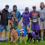 Winning team Stinky Rats Brady McDonell, Sam Fernandez, Kristen Strom, Jason Norat and Sean Griffin pose at the finish line of the Seacoast Relay at the Eagle Beach State Park outer beach picnic shelter on Sunday, June 8, 2025. (Klas Stolpe / Juneau Empire)