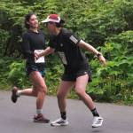 Snow Doubts Trinity Jackson hands off to Ricardo Worl at the Auke Village Recreation Area during the Seacoast Relay on Sunday, June 8, 2025. (Klas Stolpe / Juneau Empire)