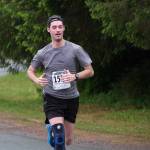 Snow Doubts Justin Sleppy approaches the finish line of the Seacoast Relay at the Eagle Beach State Park outer beach picnic shelter on Sunday, June 8, 2025. (Klas Stolpe / Juneau Empire)