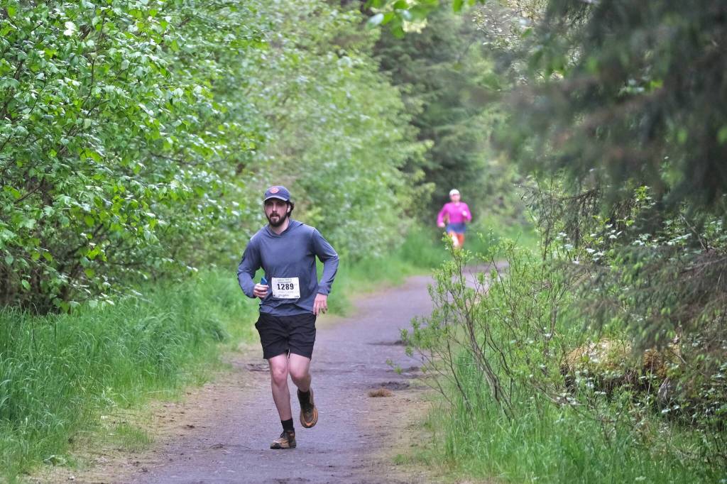 Troy Stallings approaches the finish of the East Glacier Trail Tangle on Tuesday. The 4.9-mile race follows part of Under Thunder Trail around East Glacier Trail and back. (Klas Stolpe / Juneau Empire)