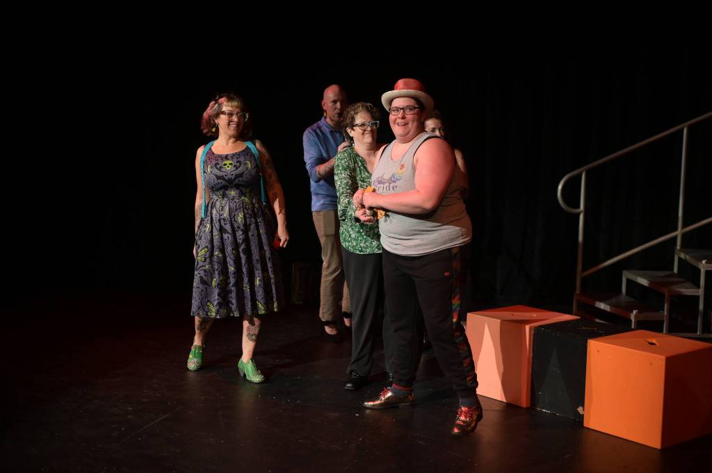 Kelsey Bryce Riker (right) smiles during a tech rehearsal for the 10th annual GLITZ on Wednesday, June 25, 2025. (Jasz Garrett / Juneau Empire)