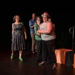 Kelsey Bryce Riker (right) smiles during a tech rehearsal for the 10th annual GLITZ on Wednesday, June 25, 2025. (Jasz Garrett / Juneau Empire)