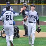 Juneaus Auke Bay Post 25 relieve pitcher Marcus Mendoza (21) and starting pitcher Cayman Huff (16) exchange the mound against Palmer Post 15 during Juneaus 7-6 win over Palmer in American Legion Baseball action Sunday at Adair Kennedy Memorial Park. (Klas Stolpe / Juneau Empire)