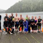 Racers pose for a photo after Saturdays third race of the Open Water Swim Series on Auke Lake. (Klas Stolpe / Juneau Empire)