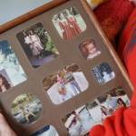 Faith Rogers younger sister Michelle Rogers holds a photo collage of Faith that hung on the wall in their family home in September 2022. (Clarise Larson / Juneau Empire file photo)
