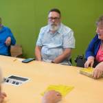Debbie Penrose-Fischer hands out tips on glacial lake outburst flood preparation on Thursday, June 26, 2025. (Jasz Garrett / Juneau Empire)