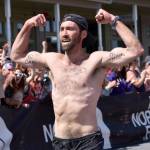 James Carlberg, 34, of Seward finishes the mens race at the Mount Marathon Race on July 4, 2025, in Seward, Alaska. (Photo by Jeff Helminiak/Peninsula Clarion)