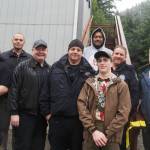 Max Webster stands with Lemon Creek Correctional Center staff in front of new control tower on Tuesday, July 9, 2025. (Natalie Buttner / Juneau Empire)