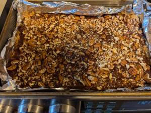 Toasted nuts top this shortbread cookie bar.