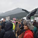 Protesters stand at the No Tsars, No Kings protest on Saturday, Oct. 18 at Overstreet Park. (Mari Kanagy/Juneau Empire)