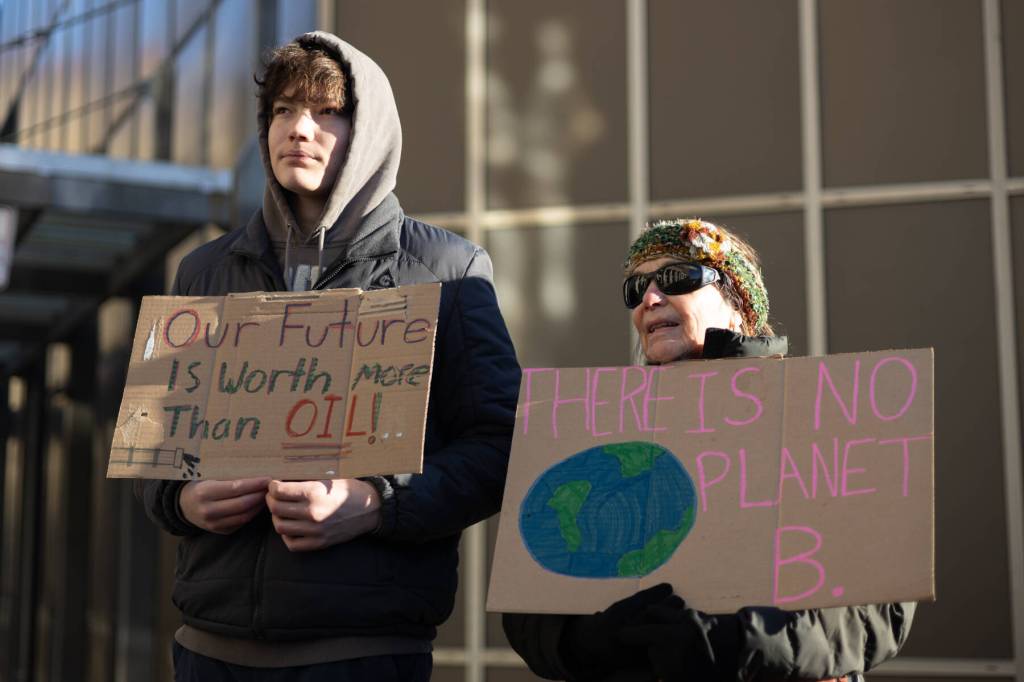 Chloe Anderson / Juneau Empire
Felix Dean protests alongside his grandmother, Shar Fox, during an anti-LNG pipeline demonstration outside the Alaska State Capitol on Saturday, Jan. 24, 2026.