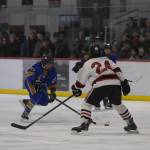 JDHS senior Isaac Phelps guards Mariners freshman Cameron Fox in front of a packed Treadwell Arena on Friday, Jan. 23, 2026. (Chloe Anderson / Juneau Empire)