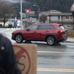 Drivers honk and wave at protesters gathered outside Senator Lisa Murkowskis Juneau office on Feb. 4, 2026. (Chloe Anderson/Juneau Empire)