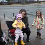 Alyssa Beckley and her two daughters participate in a peaceful protest outside Senator Lisa Murkowskis Juneau office on Feb. 4, 2026. (Chloe Anderson/Juneau Empire)