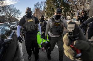 David Guttenfelder/The New York Times
FILE  Federal agents arrest a protester during an active immigration enforcement operation in a Minneapolis neighborhood, Jan. 13, 2026. The chief federal judge in Minnesota excoriated Immigration and Customs Enforcement on Wednesday, Jan. 28, saying it had violated nearly 100 court orders stemming from its aggressive crackdown in the state and had disobeyed more judicial directives in January alone than some federal agencies have violated in their entire existence.