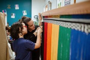 Lily Hope and her daughter Ella Hope creating the pride robe.