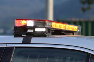 Emergency lights flash on top of a police car. Southeast Alaska Cities Against Drugs task force searched a Juneau home on March 26 in connection with an ongoing drug investigation that began in February. (Ben Hohenstatt/Juneau Empire File)