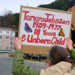 A demonstrator holds a sign for a lost loved one, Tamara Johnson, during a march in Juneau to raise awareness of Missing and Murdered Indigenous Peoples on May 5, 2026. (Photo by Corinne Smith/Alaska Beacon)