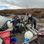 From left, Steve Dykstra, Eli Gomez and Evan Joyce prepare to deploy instruments to collect data at the mouth of the Kuskokwim River in summer 2024. (Photo by Dan Gilliki)